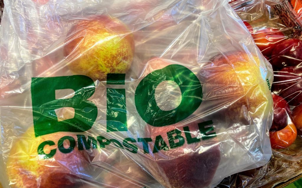bio compostable plastic bag containing apples