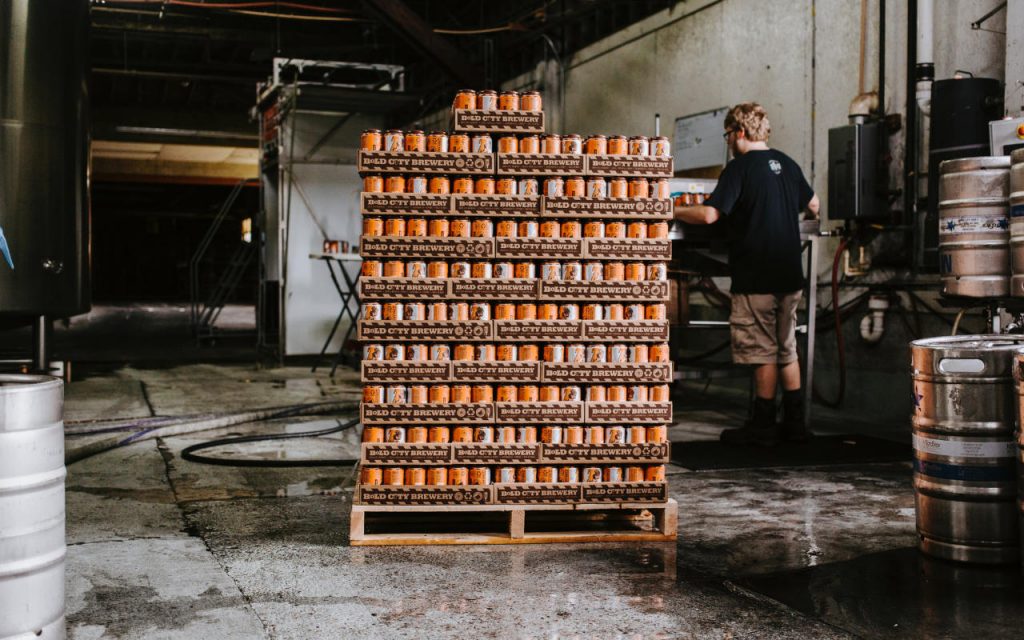 Drinks cans loaded onto a pallet in a warehouse