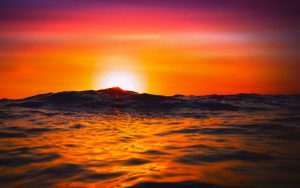 A deep orange sunset over the ocean