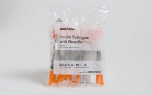 A photo of a custom polythene bag for insulin syringes, printed with contents information