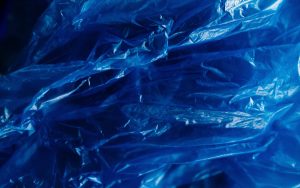 Blue plastic sheeting on black background