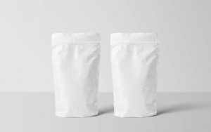 Two white bottom gusseted polythene bags, on a white background