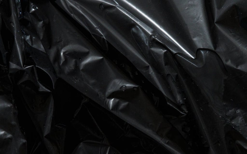 Clear polythene film on a black background, showing high clarity polythene in action